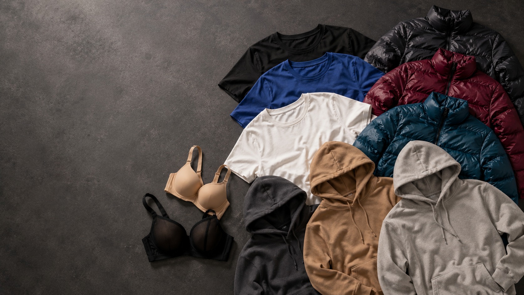 Selected apparel assortment showing hoodies, puffer jackets, tees and intimates arranged for buyer presentation